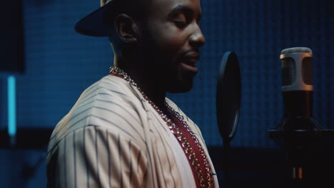 Young-Blues-Male-Singer-Recording-A-Vocal-And-Singing-His-Song-In-The-Microphone-In-The-Sound-Studio-Room