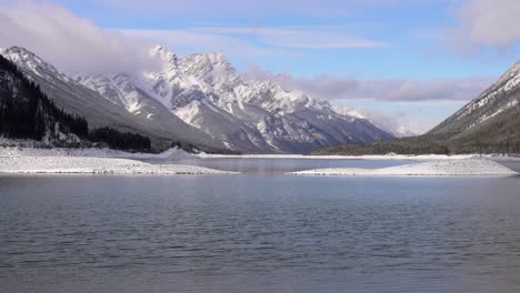 panning shot of a lake in the winter deep in the canadian rockies. kananaskis..