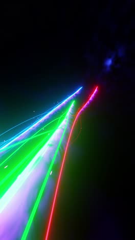 multicolored laser trails flying in space. vertical looped video