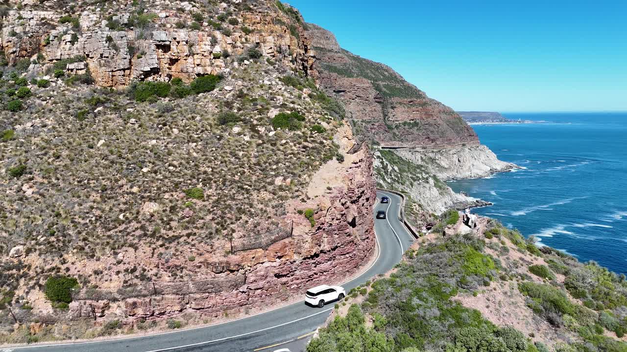 drone above Chapman's Peak Drive Chappies v a spectacular 9km winding route that offers breathtaking views of the Atlantic Ocean and cliffs in Cape Town South Africa