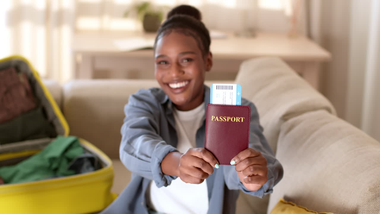 Woman Excitedly Showing Passport and Boarding Pass
