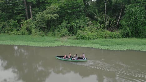 boat carrying tourists in costa rican jungle
