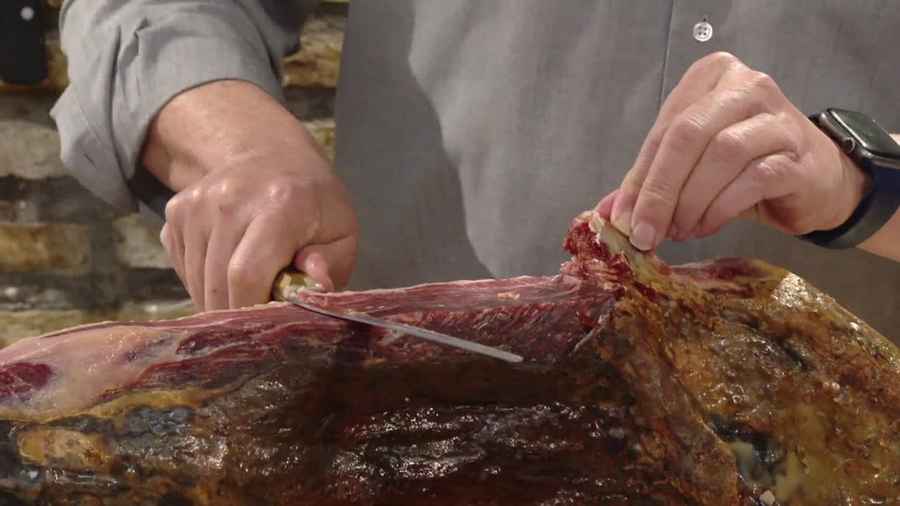 Cutting a Piece of Jamón