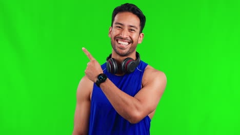 Fitness,-pointing-and-man-in-a-studio-with-green