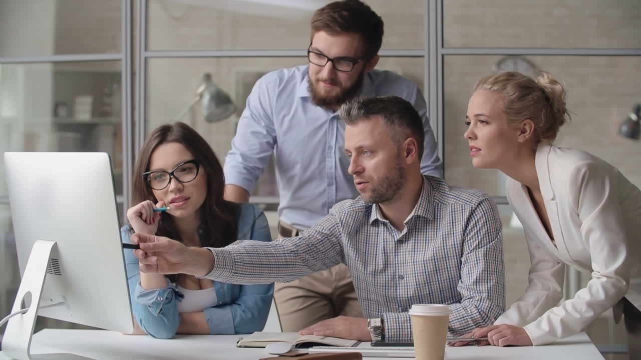 Group Of Workers Looking At Computer Screen In Office Free Stock Video ...