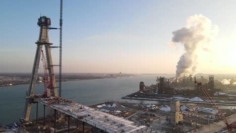 gordie howe bridge construction site with steaming plant in foreground, aerial view