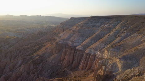 Geologic layers, eons of erosion seen in sunset aerial of Cappadocia