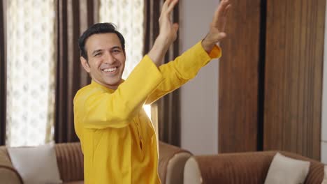 Happy-Indian-man-dancing-in-ethnic-outfit