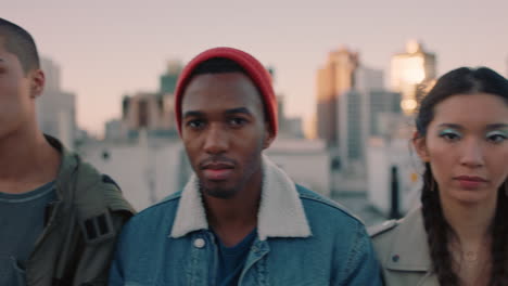 close-up-group-of-young-diverse-friends-hanging-out-on-rooftop-at-sunset-looking-confident-in-urban-city-gen-z-concept