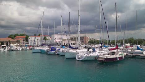 stunning hd footage of various boats and saliboats docked in koper's marina in slovenia