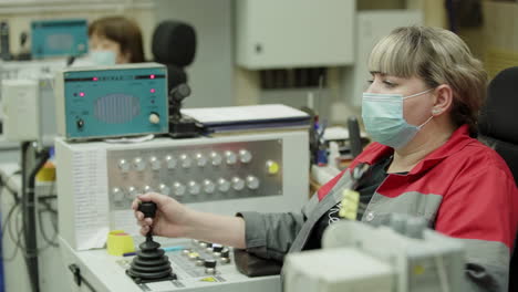 woman operating industrial machinery