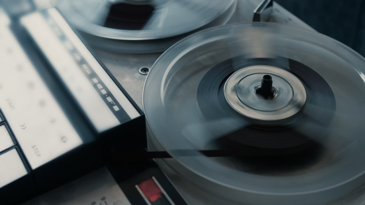 Vintage Reel-to-Reel Tape Recorder Playing Audio