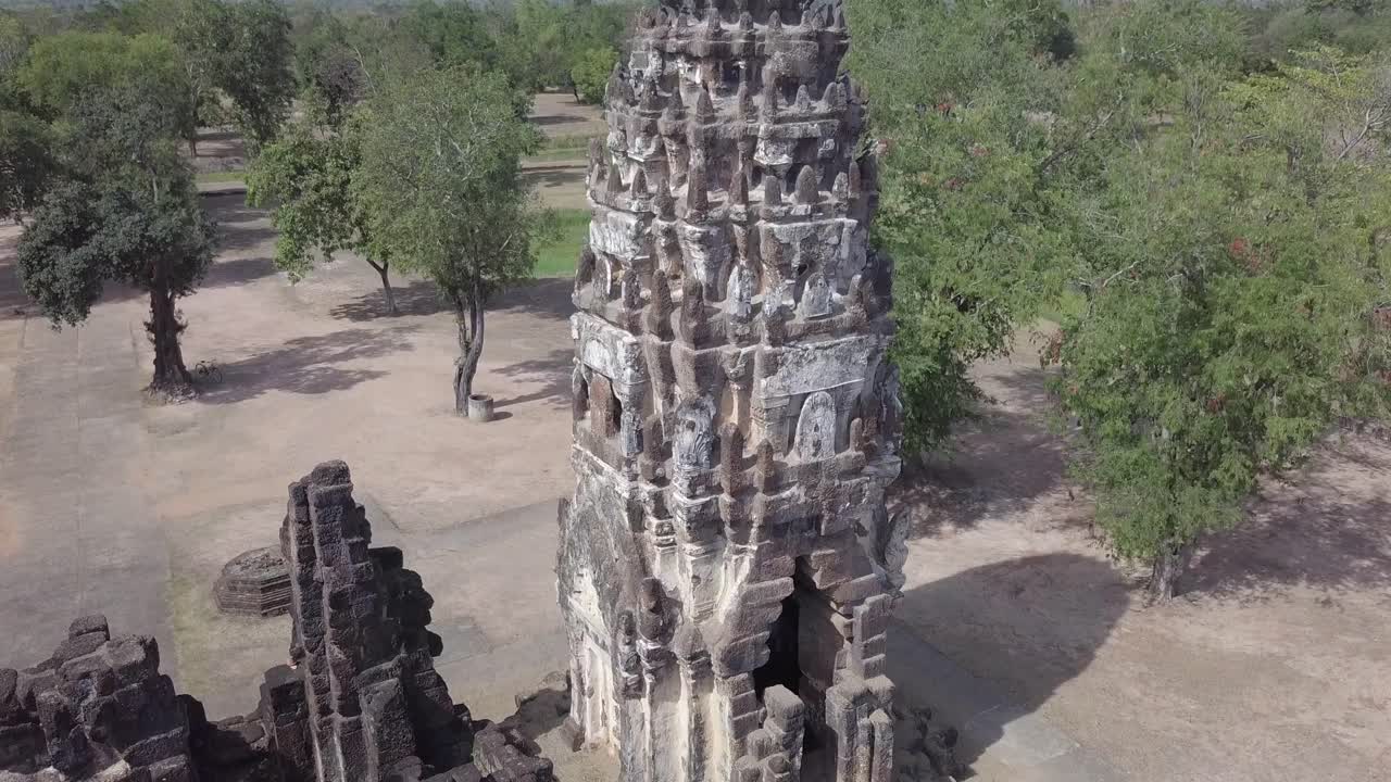 Aerial view of Wat Phra Phai Luang Temple tower at Sukhothai historical park.Descending from top towards ground.Some Birds at the top of the tower.