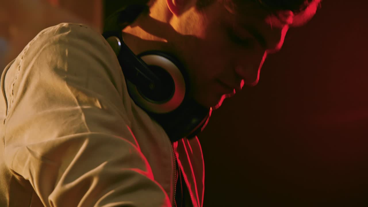 Man Shaking Head to Rhythm of Music