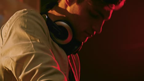 man shaking head to rhythm of music