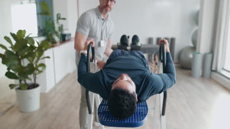 inversion, table and man in therapy for back pain