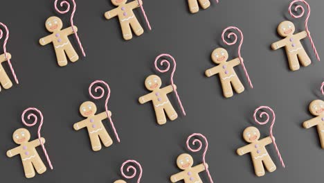 gingerbread men and candy canes on a black background