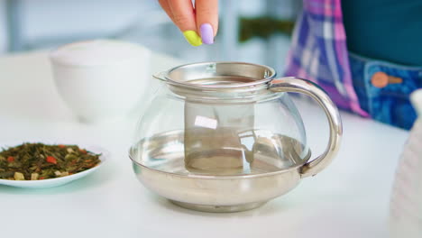 pressing green tea leaves