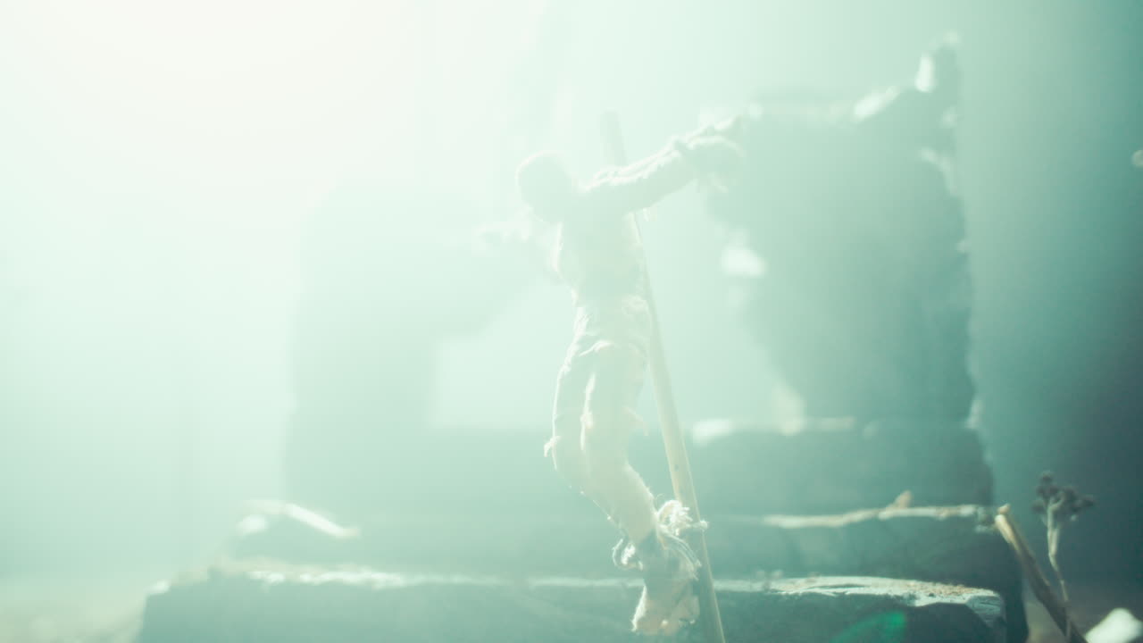 Miniature mummified dolls hanging on the gallows at night