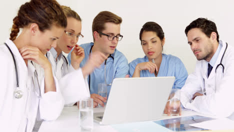 Doctors-smiling-at-camera-during-a-meeting