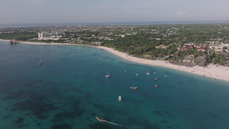 panorama of coastline at sunny day, drone view of sandy beach, turquoise ocean and luxury resort, zanzibar,tanzania