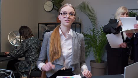 young adult business woman pointing to camera, choosing lucky one winner, meaning we need you