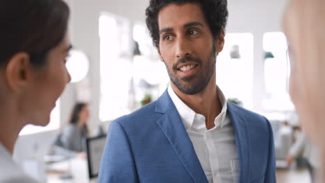 businessman, women or talking in modern office