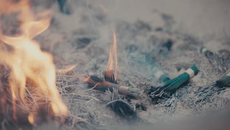 burning incense sticks at shinto shrine in tokyo, japan