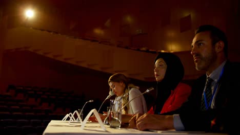 Beautiful-young-Caucasian-businesswoman-speaks-in-business-seminar-in-auditorium-4k