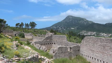Beautiful-view-of-old-fortress-and-ruins-with-mountains-and-blue-sky