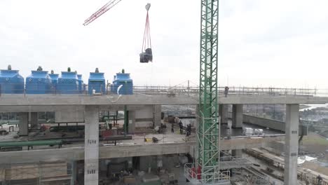 aerial view of building construction, loading of materials