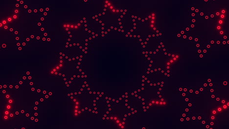 Symmetrical-red-dot-pattern-on-black-background