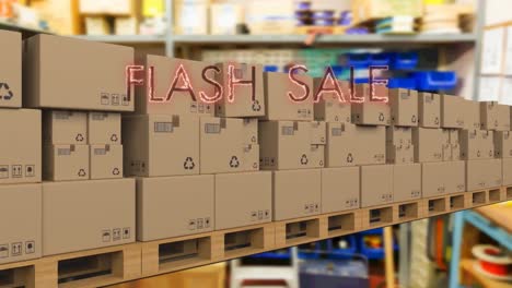 Neon-red-flash-sale-text-banner-over-multiple-delivery-boxes-on-conveyer-belt-against-factory