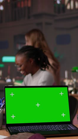 vertical video college student looks at a copy space on laptop while collecting notes