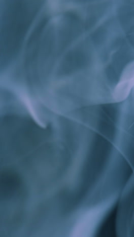 Slow-motion-of-abstract-white-smoke-against-black-background