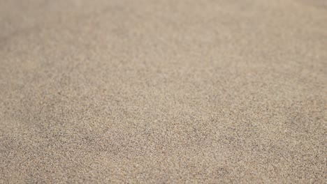 Sand-dune-grains-in-desert-falling-down-hill