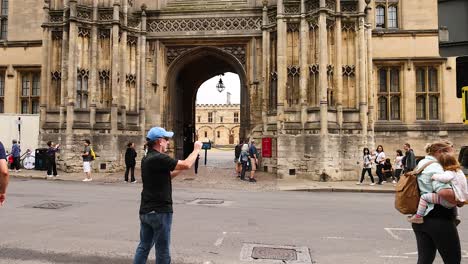 tourists capturing moments at christ church, oxford