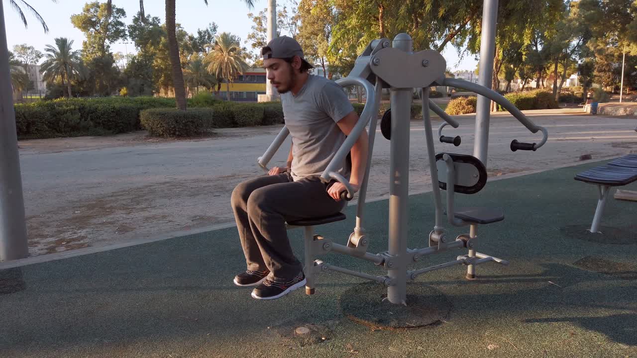 young man, lift your own weight in fitness equipment.