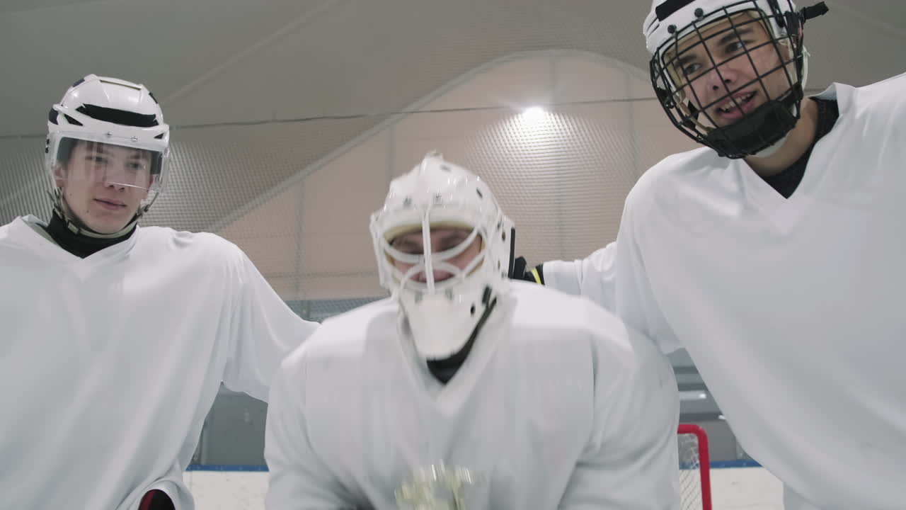 Hockey Players With Victory Cup