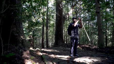 hiker exploring kumano forest walking along the ancient kumano kodo pilgrimage route in japan