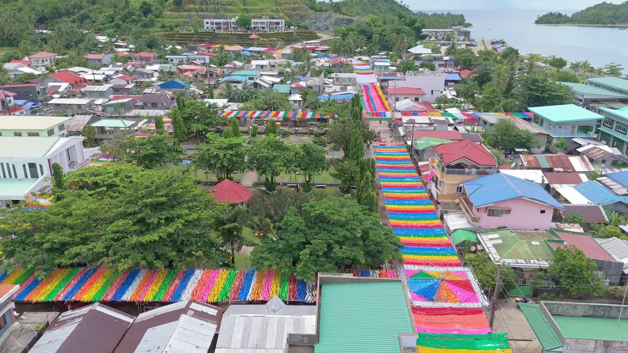 Cagdianao colorful street decoration for annual Sirong Sirong festival, Dinagat Islands, Drone shot