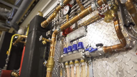 Hydronic-heating-system-with-valves-tubes-pipes-boilers-heat-for-recirculating-hot-water-to-efficient-baseboard-radiant-in-floor