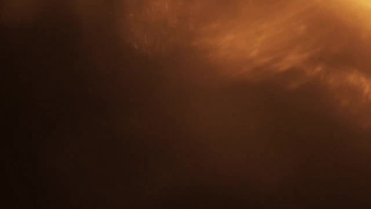 Transizione Flare con Luce Dorata su Sfondo Nero