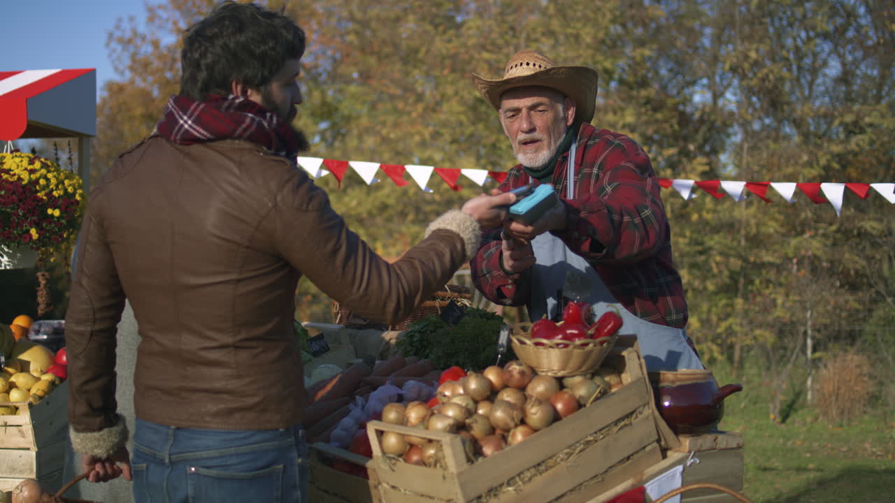 Customer Paying for Produce at Farmer's Market
