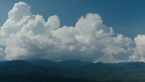 mountain range with cumulus clouds