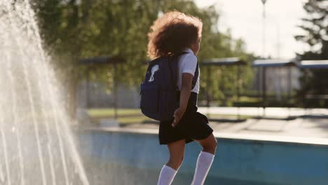 schoolgirl walking in park