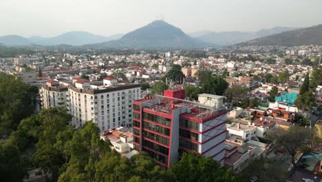 Aerial-view-city-between-hills,-urban-stain-in-Latin-America-Mexico-City