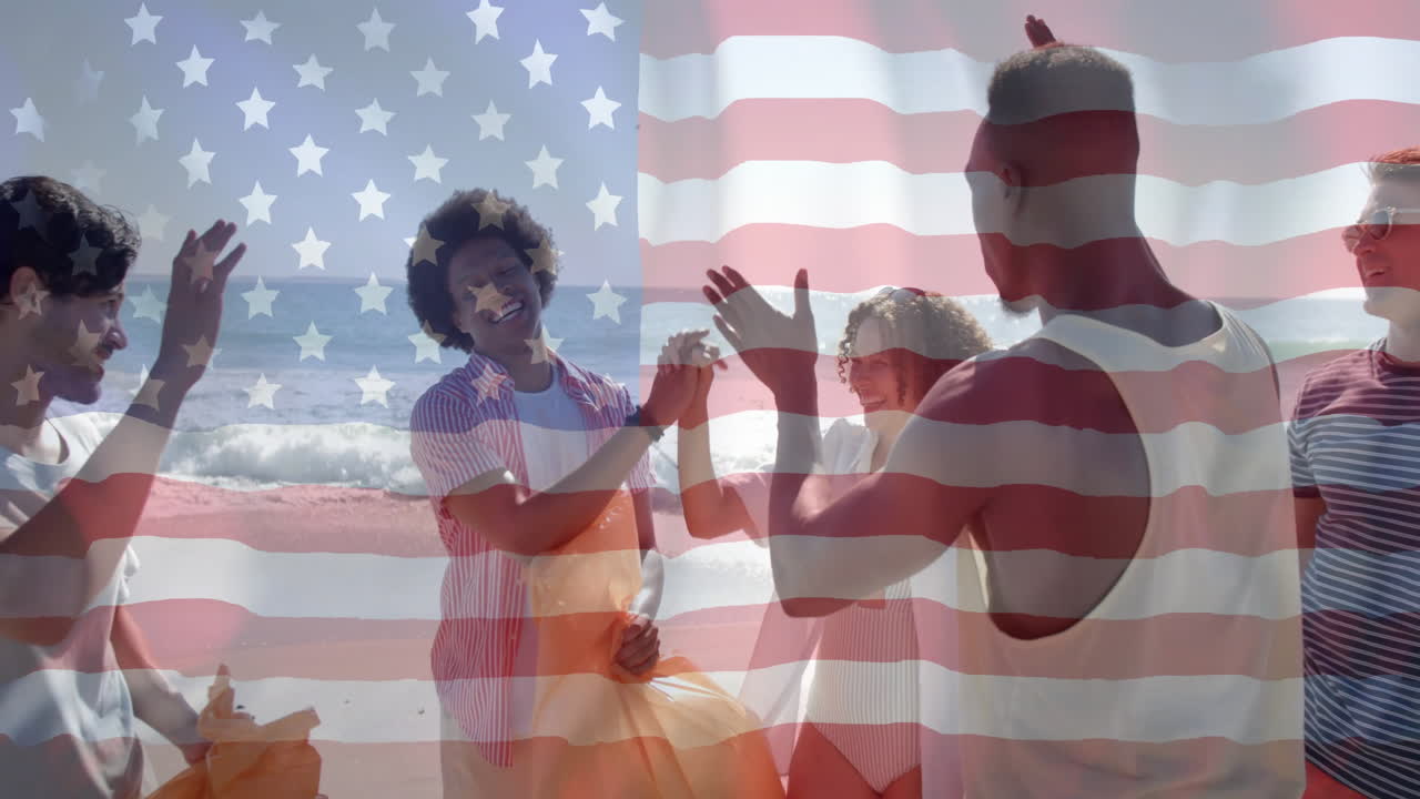 Animation of flag of usa over diverse friends high fiving on beach