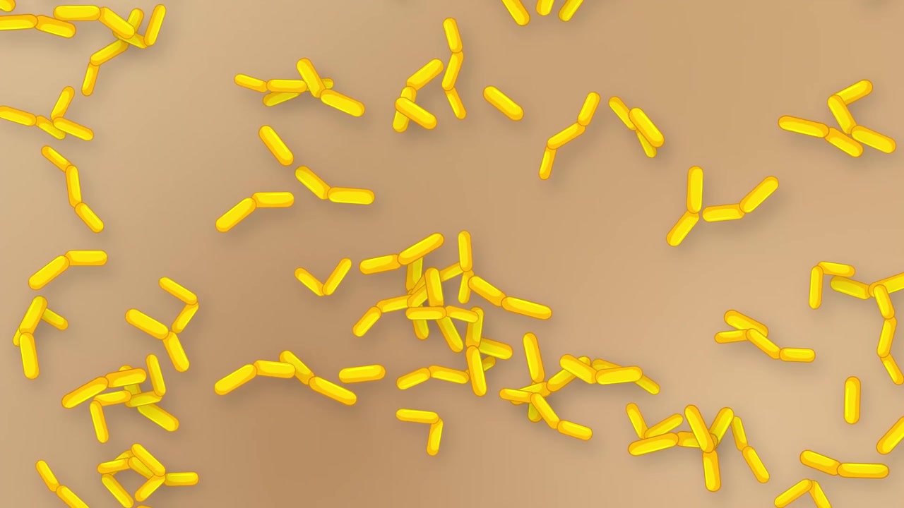 Oggetti microscopici gialli a forma di bastoncino cadono e rotolano su uno sfondo a rete testurizzato color sabbia.