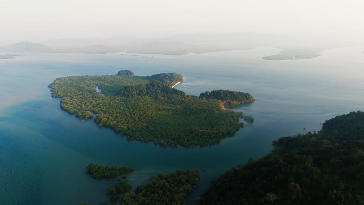 Laem Son National Park in Thailand, drone aerial Tropical coastline and dense forest from above with sandy beach island